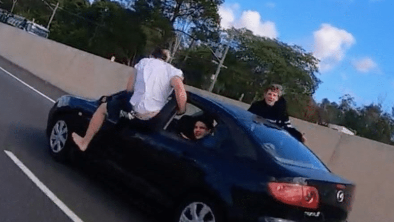 Motorcyclist Captures Outrageous High-Fiving Incident on Queensland Highway